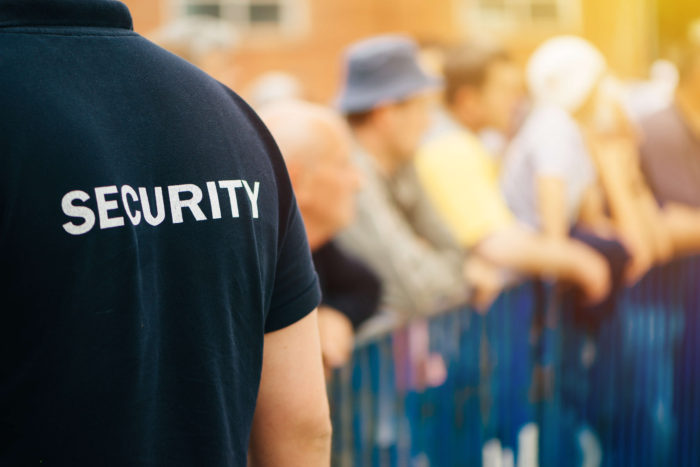 Security officer displaying customer service skills at public event